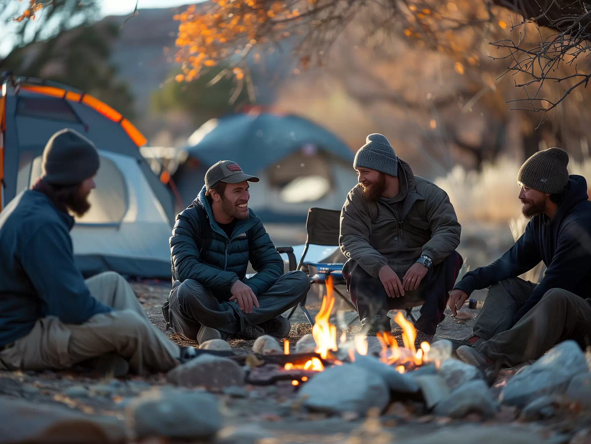 Men Gathering Around Campfire A group of men sitting and chatting leisurely around a blazing campfire in the wilderness.