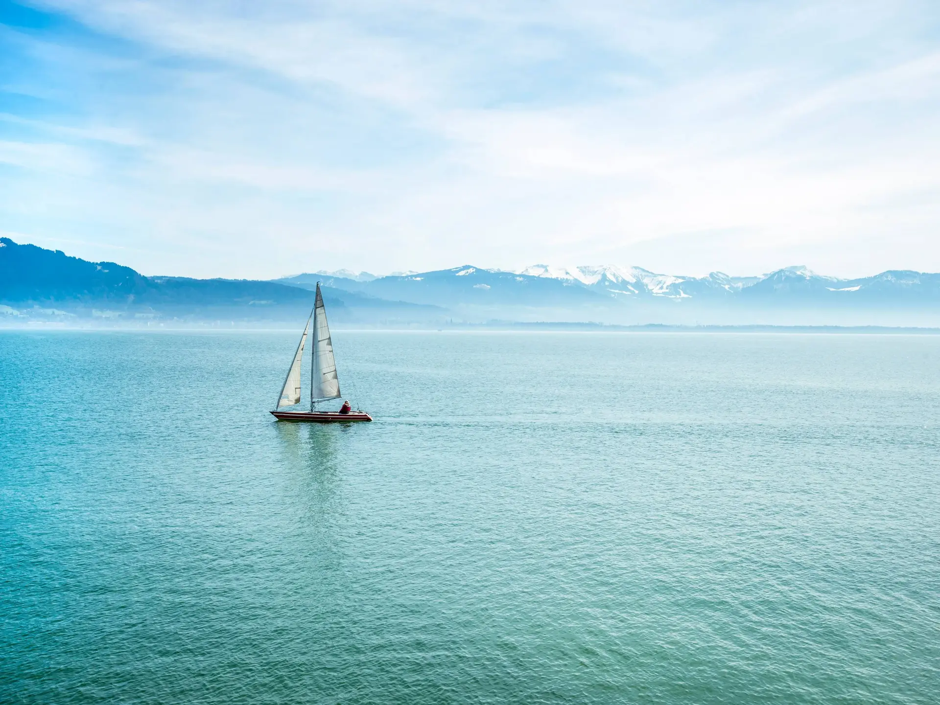 lake constance Bodensee and alps with blue sky and clouds in Bavaria, Germany