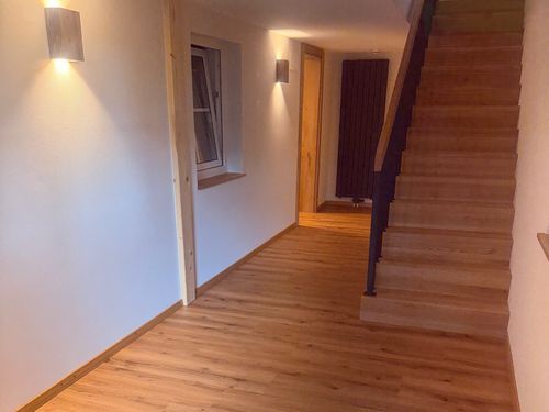 Treppenhaus mit Zugang in die 1. Etage