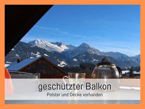 Biohof Burger Titelbild Balkon Winter Oberstdorfer Berge