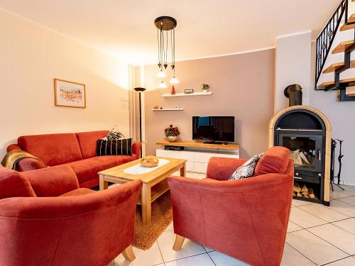 Ferienhaus: Wohnraum mit Kaminofen