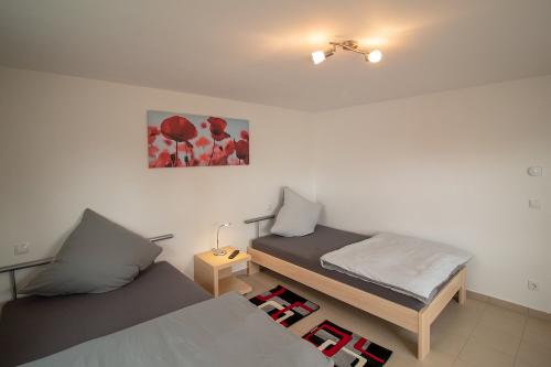 Schlafzimmer mit zwei Einzelbetten Whg 1