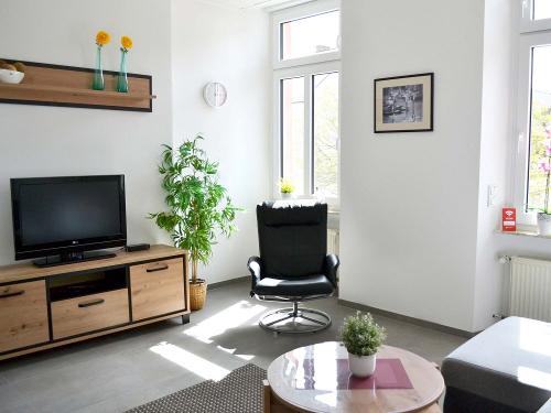 Fewo Perlwein - Wohnraum mit TV